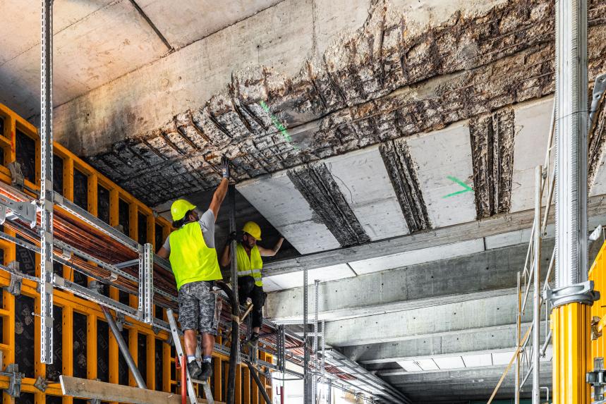 construction site worker repairs old subway infrastructure 