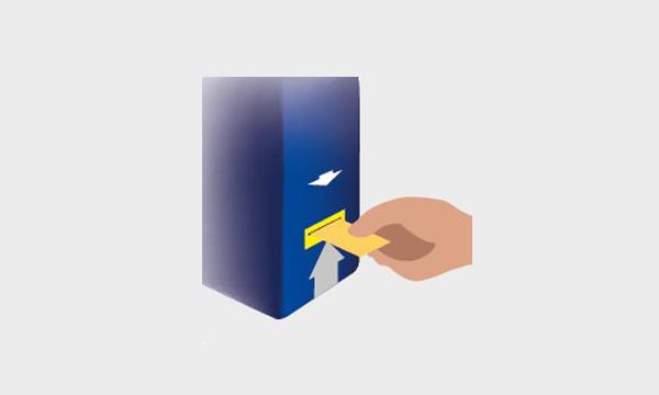 the graphic shows a hand inserting a ticket in a validator