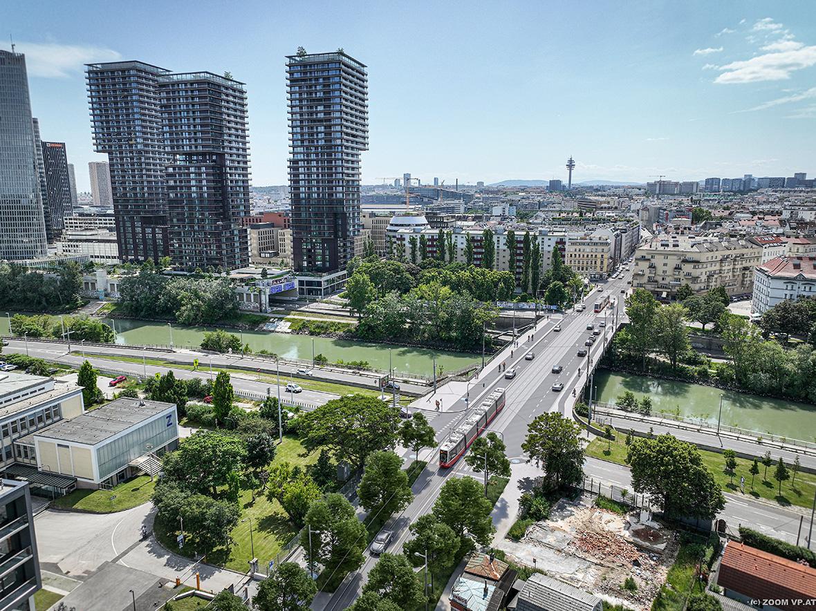 Visualisierung einer Flexity Straßenbahn der Linie 18 die die Stadionbrücke überquert im Hintergrund die Triiiple Türme